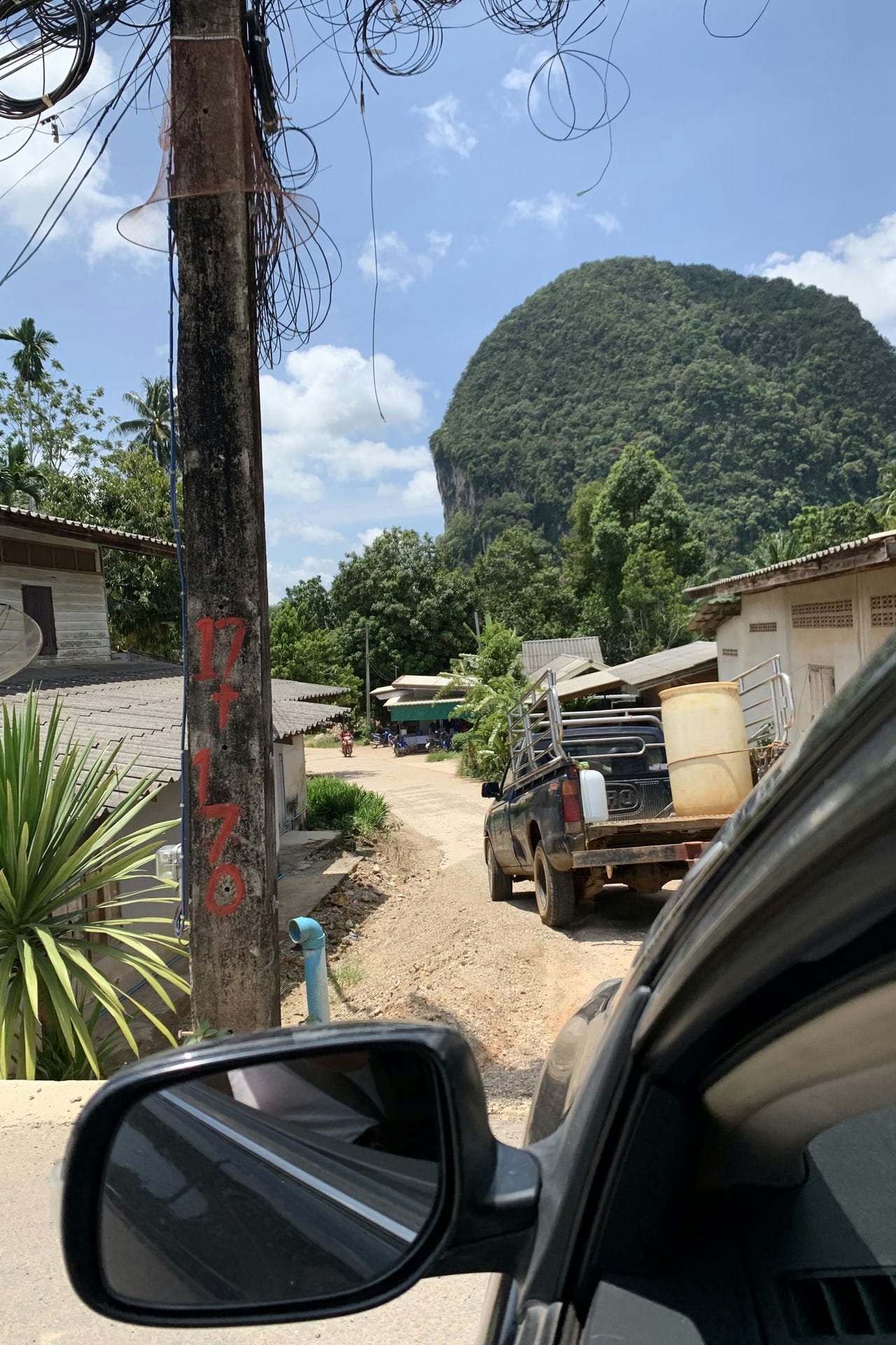 Driving behind te farmer to the Durian Farm